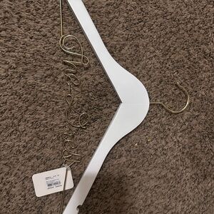 Bride/the dress hanger never used. Flaws are showed